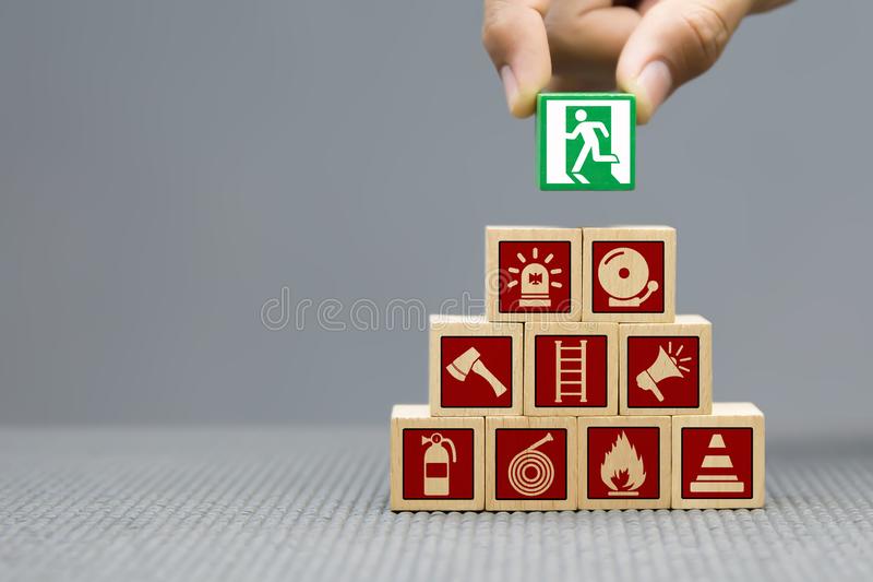 close-up-image-hand-selected-graphic-symbol-fire-exit-wooden-blocks-toy-escape-icons-concepts-159251