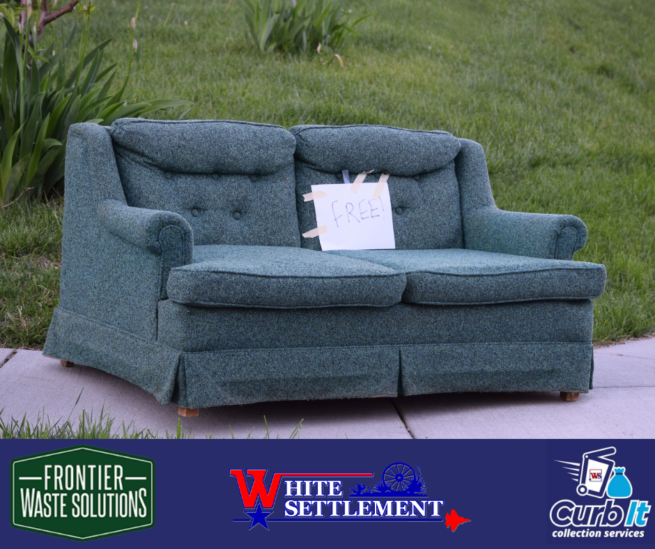 a couch sitting on the curb with a sign on it indicating it is free